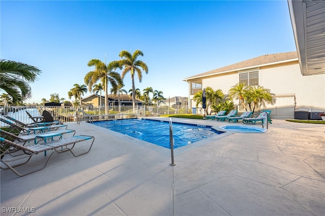 912 SW 48th Ter Unit 108, Cape Coral, FL 33914 - view of pool featuring a patio, fence, and a pool with connected hot tub