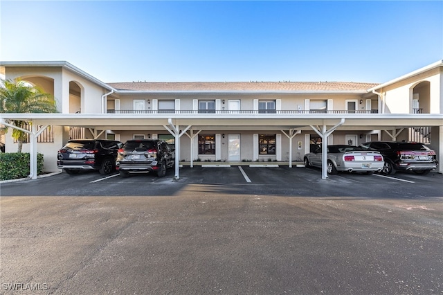 912 SW 48th Ter Unit 108, Cape Coral, FL 33914 - view of building exterior featuring covered parking