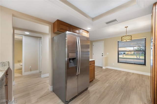 912 SW 48th Ter Unit 108, Cape Coral, FL 33914 - kitchen featuring stainless steel fridge with ice dispenser, brown cabinets, light wood-type flooring, ornamental molding, and baseboards