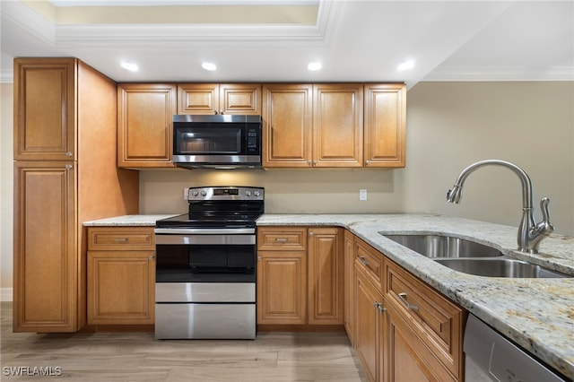 912 SW 48th Ter Unit 108, Cape Coral, FL 33914 - kitchen with stainless steel appliances, a sink, crown molding, light stone countertops, and recessed lighting