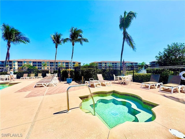 8550 Kingbird Loop Unit 638, Estero, FL 33967 - view of pool with a patio, a swimming pool, and a hot tub