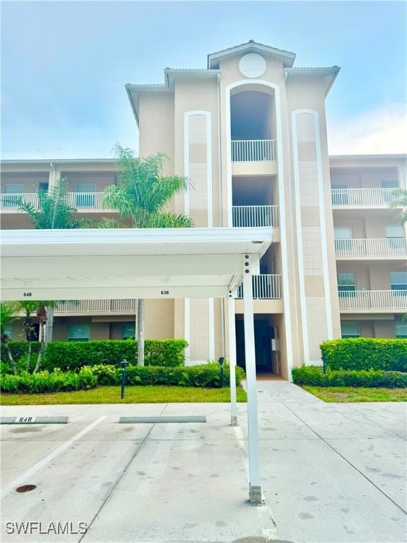 8550 Kingbird Loop Unit 638, Estero, FL 33967 - view of building exterior featuring covered parking
