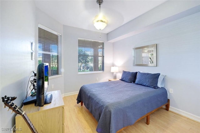 10530 Amiata Way Unit 105, Fort Myers, FL 33913 - bedroom featuring baseboards and light wood-type flooring