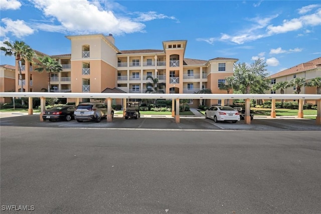 10530 Amiata Way Unit 105, Fort Myers, FL 33913 - view of property featuring covered parking
