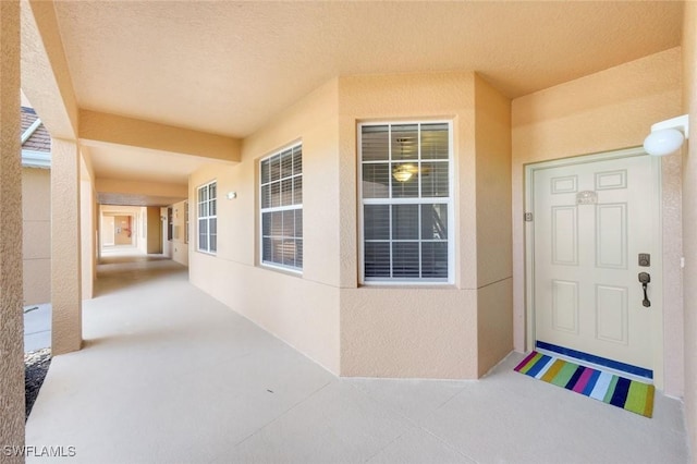 10530 Amiata Way Unit 105, Fort Myers, FL 33913 - view of exterior entry featuring stucco siding