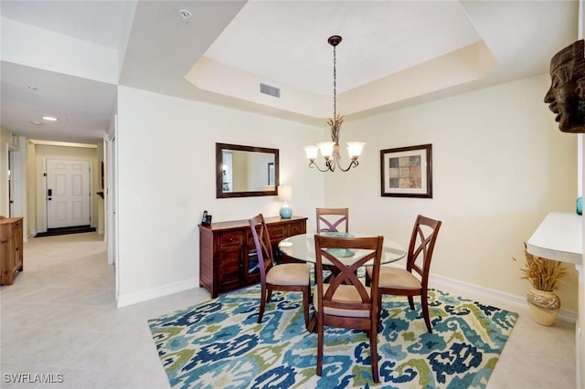 10530 Amiata Way Unit 105, Fort Myers, FL 33913 - dining room featuring a tray ceiling, baseboards, visible vents, and light tile patterned flooring