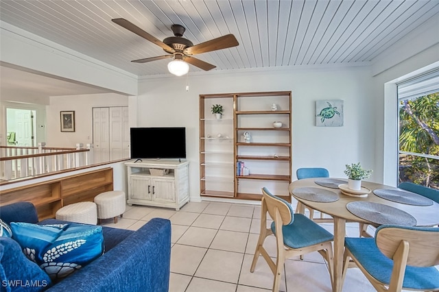 living area with light tile patterned flooring, wood ceiling, crown molding, and ceiling fan
