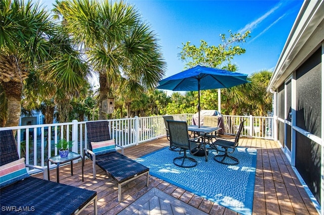 deck with outdoor dining space