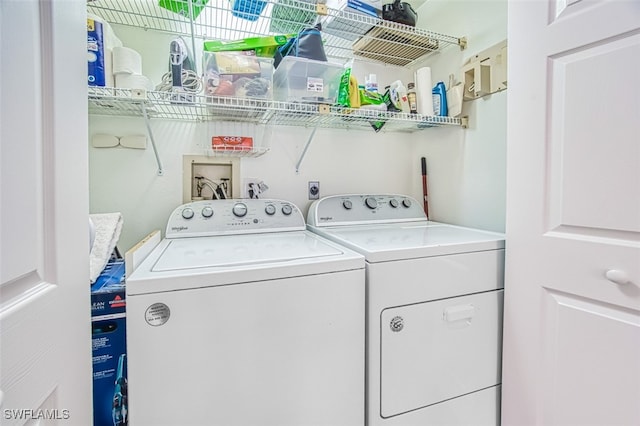 washroom with laundry area and washing machine and clothes dryer