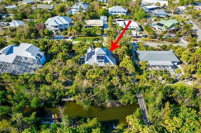 birds eye view of property featuring a residential view and a water view