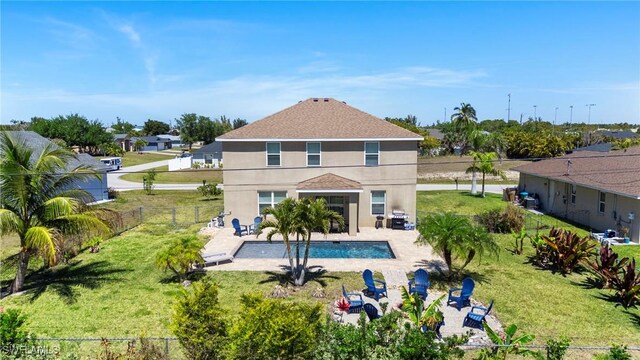 326 SW 31st St, Cape Coral, FL 33914 - outdoor pool featuring a fenced backyard, a lawn, and a patio