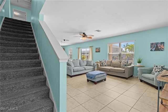 326 SW 31st St, Cape Coral, FL 33914 - living room featuring stairway, light tile patterned floors, baseboards, ceiling fan, and visible vents