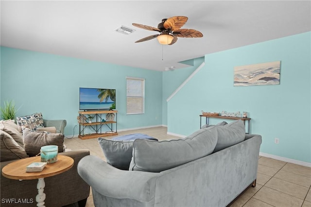 326 SW 31st St, Cape Coral, FL 33914 - living room with light tile patterned flooring, baseboards, visible vents, and a ceiling fan