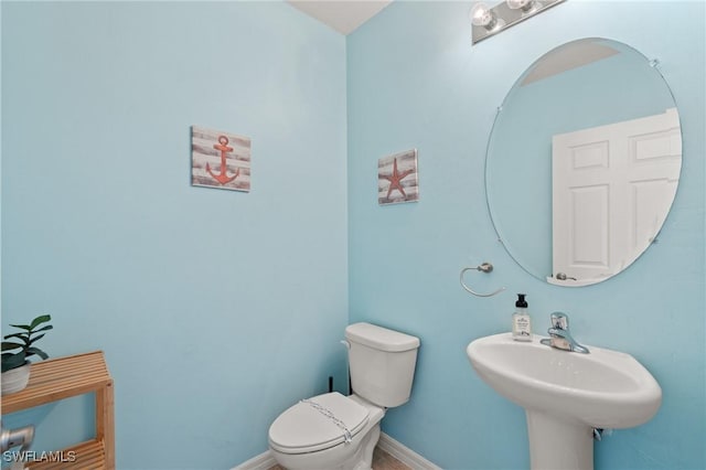 326 SW 31st St, Cape Coral, FL 33914 - half bath with toilet, a sink, and baseboards