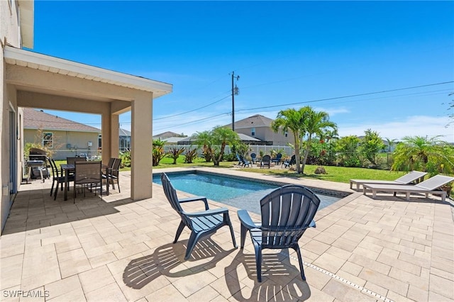 326 SW 31st St, Cape Coral, FL 33914 - view of pool featuring a patio, fence, a fenced in pool, and outdoor dining space