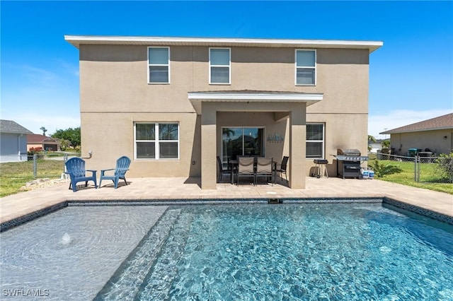 326 SW 31st St, Cape Coral, FL 33914 - back of property featuring stucco siding, fence, and a patio