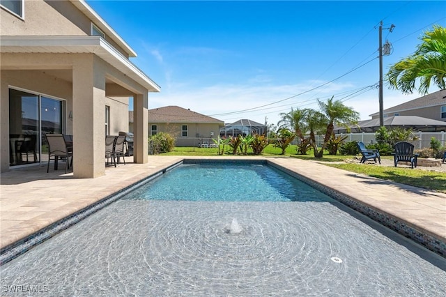 326 SW 31st St, Cape Coral, FL 33914 - view of swimming pool featuring a patio area, fence, and a fenced in pool