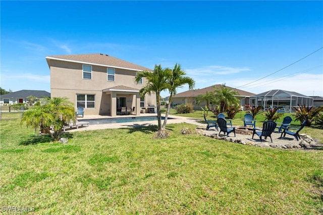 326 SW 31st St, Cape Coral, FL 33914 - rear view of house with stucco siding, a fire pit, a yard, and a patio area