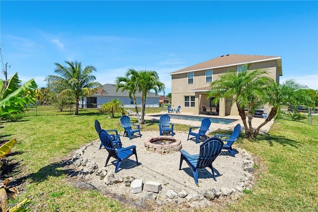 326 SW 31st St, Cape Coral, FL 33914 - exterior space with an outdoor pool, a patio, stucco siding, a fire pit, and a yard