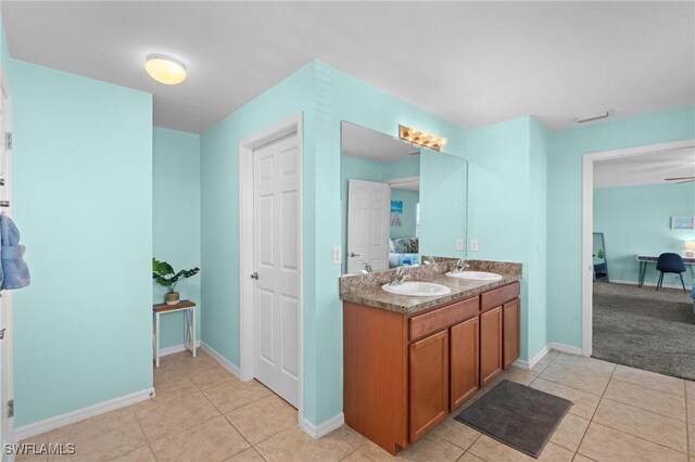 326 SW 31st St, Cape Coral, FL 33914 - bathroom with tile patterned flooring, a sink, connected bathroom, and double vanity
