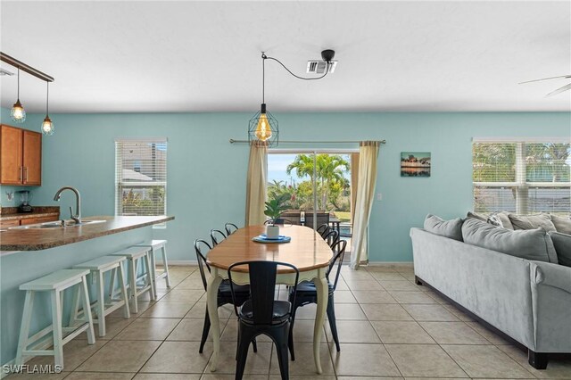 326 SW 31st St, Cape Coral, FL 33914 - dining area with baseboards, visible vents, and light tile patterned floors