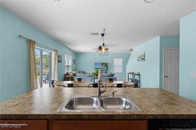 326 SW 31st St, Cape Coral, FL 33914 - kitchen with a sink, a center island with sink, dishwashing machine, open floor plan, and visible vents