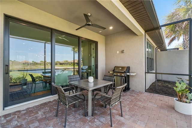 8021 Calle Canovas Ct, Naples, FL 34114 - view of patio / terrace featuring area for grilling, a ceiling fan, and a water view
