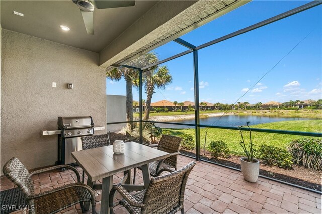 8021 Calle Canovas Ct, Naples, FL 34114 - sunroom / solarium with a water view, a ceiling fan, outdoor dining space, and a residential view