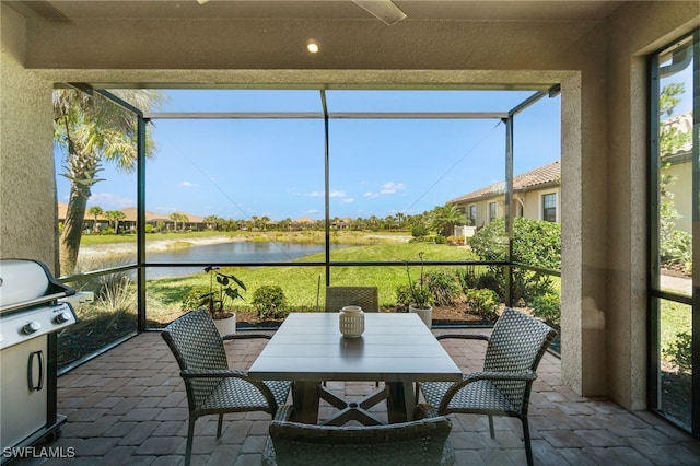 8021 Calle Canovas Ct, Naples, FL 34114 - sunroom / solarium with a water view and outdoor dining space