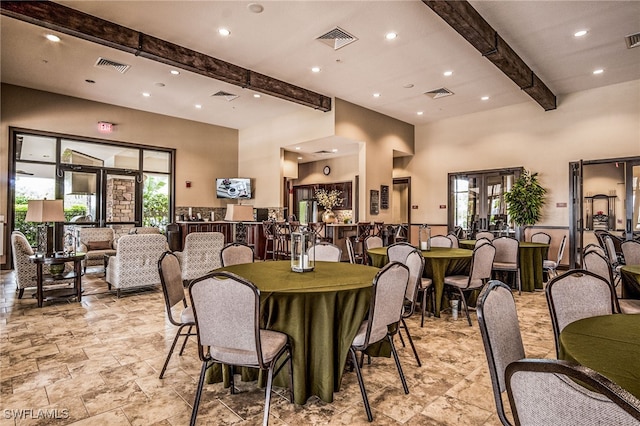 8021 Calle Canovas Ct, Naples, FL 34114 - dining space featuring beam ceiling, recessed lighting, french doors, light stone finish floors, and a towering ceiling