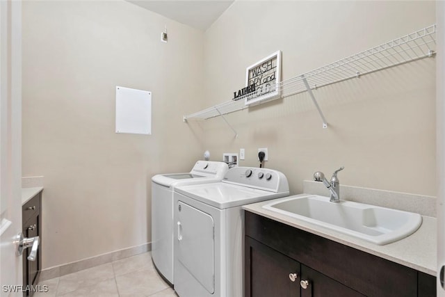 4802 Frattina St, Ave Maria, FL 34142 - laundry room featuring washing machine and clothes dryer, cabinet space, baseboards, and light tile patterned flooring