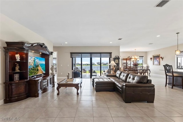 4802 Frattina St, Ave Maria, FL 34142 - living room with light tile patterned flooring, a chandelier, recessed lighting, and baseboards