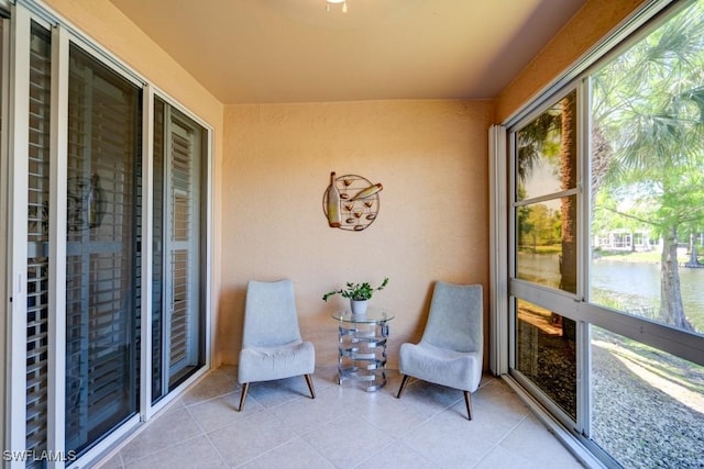 sunroom with a water view