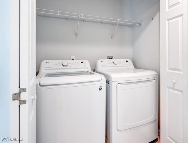laundry room featuring washer and dryer and laundry area