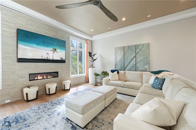 1230 Gulf Shore Blvd S, Naples, FL 34102 - living room with wood finished floors, ceiling fan, a stone fireplace, and recessed lighting