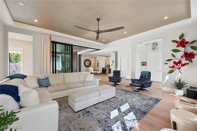 1230 Gulf Shore Blvd S, Naples, FL 34102 - living room featuring a raised ceiling, wood finished floors, a ceiling fan, baseboards, and recessed lighting