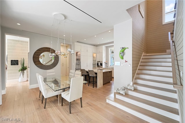 1230 Gulf Shore Blvd S, Naples, FL 34102 - dining room with stairs, light wood-style floors, recessed lighting, baseboards, and a chandelier
