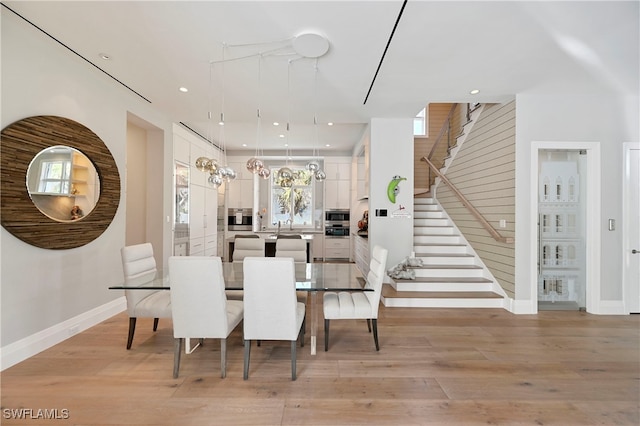 1230 Gulf Shore Blvd S, Naples, FL 34102 - dining room featuring stairway, baseboards, light wood-style floors, and recessed lighting