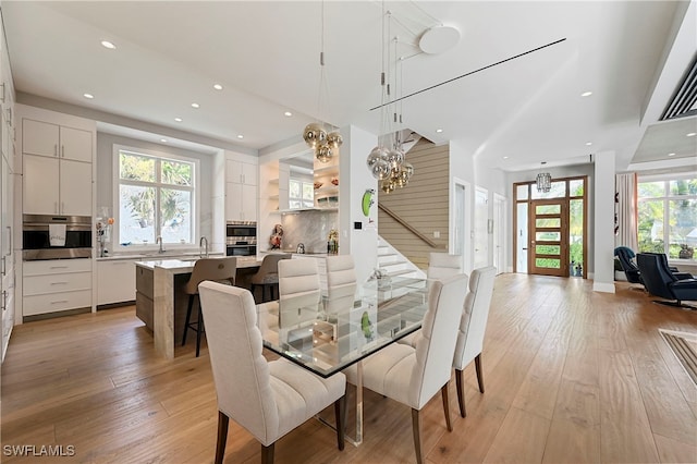 1230 Gulf Shore Blvd S, Naples, FL 34102 - dining area featuring light wood-type flooring, plenty of natural light, recessed lighting, and a chandelier