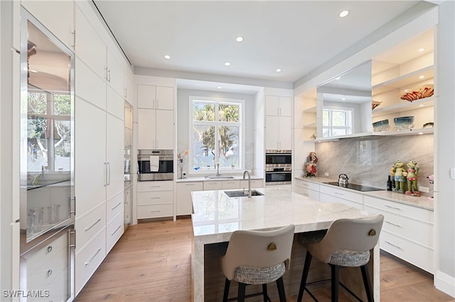 1230 Gulf Shore Blvd S, Naples, FL 34102 - kitchen featuring a sink, black electric stovetop, plenty of natural light, and recessed lighting