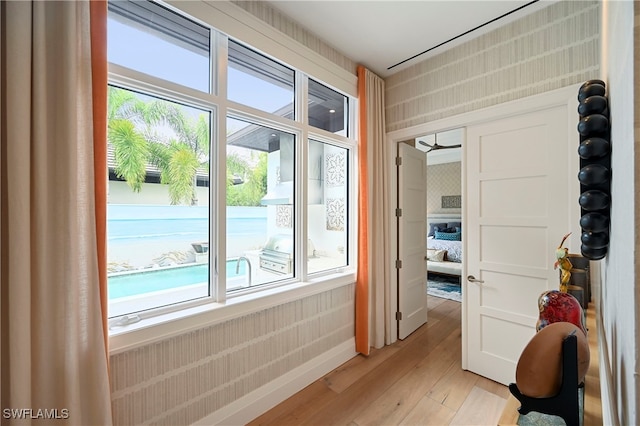1230 Gulf Shore Blvd S, Naples, FL 34102 - hallway featuring light wood-style flooring and plenty of natural light