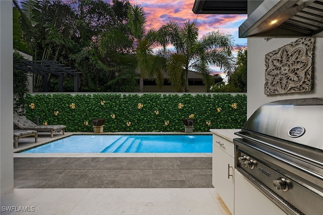 1230 Gulf Shore Blvd S, Naples, FL 34102 - pool at dusk with grilling area, a patio, and a fenced backyard
