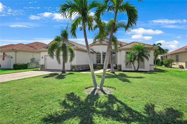 16404 Coco Hammock Way, Fort Myers, FL 33908 - view of front of property featuring stucco siding, concrete driveway, an attached garage, and a tile roof