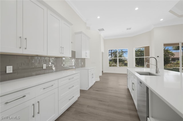16404 Coco Hammock Way, Fort Myers, FL 33908 - kitchen with stainless steel dishwasher, crown molding, healthy amount of natural light, light countertops, and recessed lighting