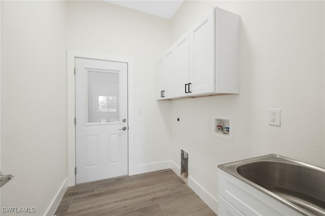 16404 Coco Hammock Way, Fort Myers, FL 33908 - washroom with cabinet space, hookup for a washing machine, electric dryer hookup, and light wood-style floors