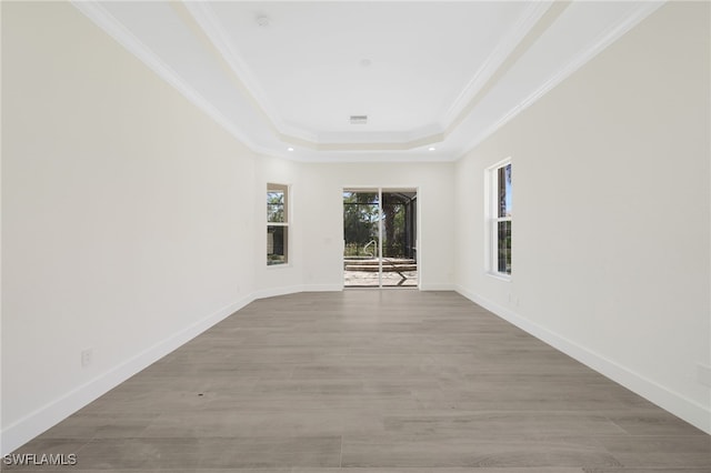 16404 Coco Hammock Way, Fort Myers, FL 33908 - unfurnished room featuring a tray ceiling, crown molding, and wood finished floors