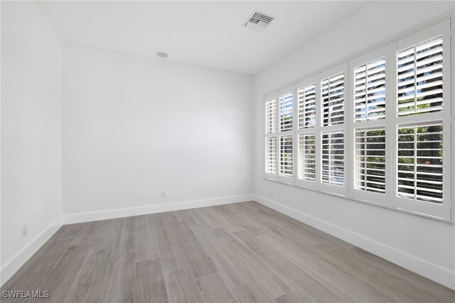 16404 Coco Hammock Way, Fort Myers, FL 33908 - unfurnished room with wood finished floors and baseboards