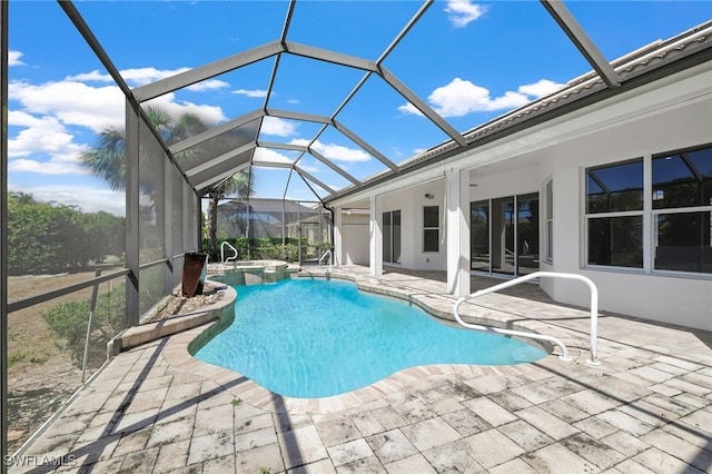 16404 Coco Hammock Way, Fort Myers, FL 33908 - view of pool with a patio area, glass enclosure, and a pool with connected hot tub