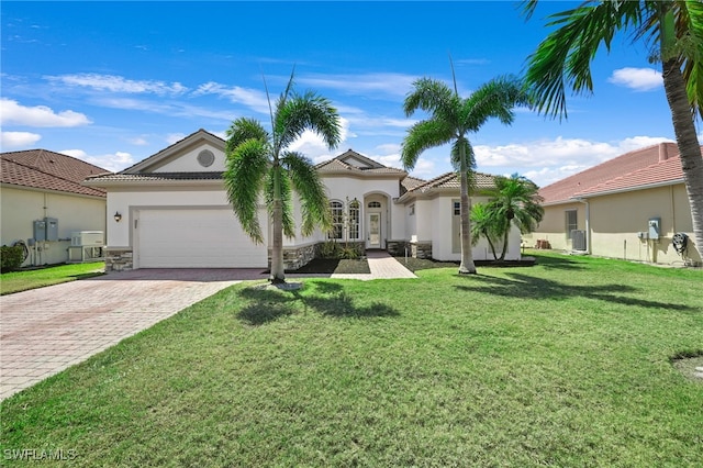 16404 Coco Hammock Way, Fort Myers, FL 33908 - mediterranean / spanish house with stucco siding, decorative driveway, an attached garage, and a tile roof