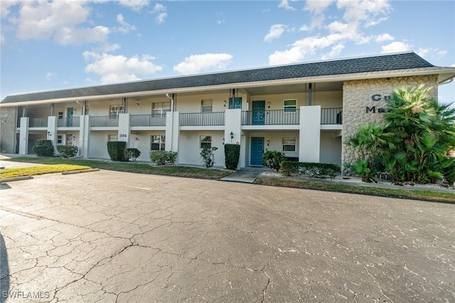 1006 SE 46th St Unit 1C, Cape Coral, FL 33904 - view of building exterior featuring uncovered parking